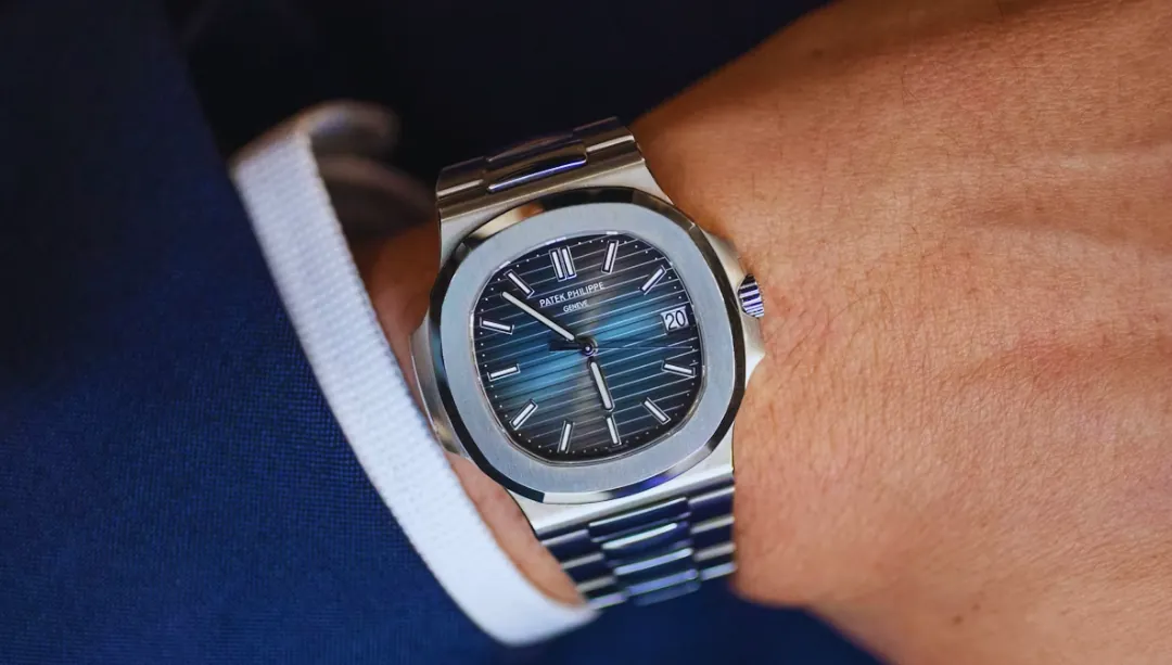 Patek Philippe Nautilus 5711 with a blue dial on a wrist